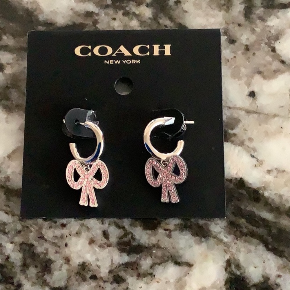 COACH silver and pink crystal bow earrings. For Pierced ears. New